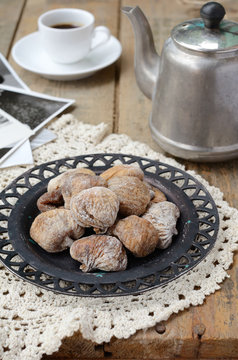 Dried figs, coffee pot, cup of coffee and vintage cards