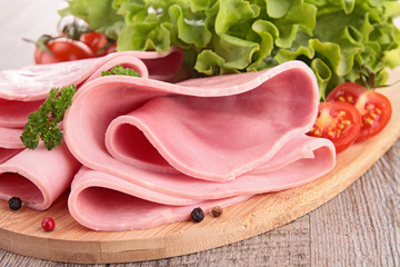 sliced pork ham with salad and tomato