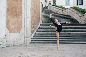 Obraz na płótnie Canvas Young beautiful ballerina dancing on the Spanish Steps in Rome, 