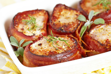 Roasted pork steak wrapped in bacon