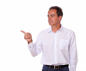 Adult hispanic man pointing to his right