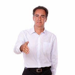 Serious hispanic man with greeting gesture