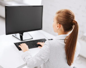 businesswoman with computer in office