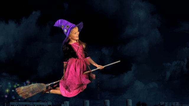 Girl in witch's hat flying on broomstick.