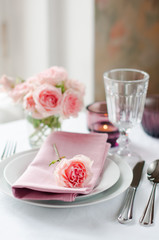 Beautiful festive table setting with roses