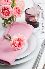 Beautiful festive table setting with roses