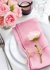 Beautiful festive table setting with roses