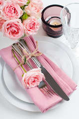 Beautiful festive table setting with roses
