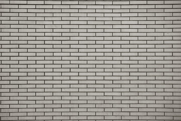 Fototapeta na wymiar Brick wall, built of flat bricks