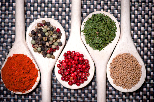 assortment mix of colorful spices with chopped parsley, mustard