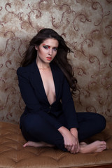 Obraz premium Sexy girl in black suit with colorful eyeshadow