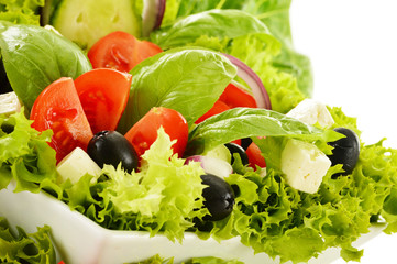 Vegetable salad bowl isolated on white