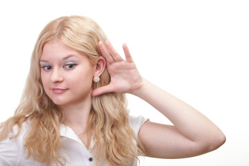 woman eavesdropping with hand behind her ear