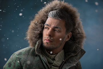 Handsome man in winter snow