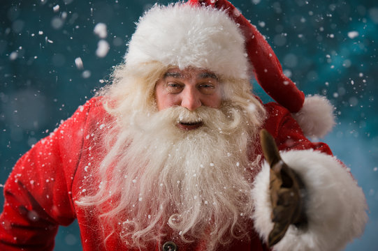 Santa Claus running outdoors at North Pole