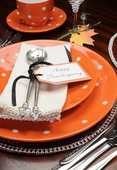 Orange polka dot Thanksgiving table place setting close up
