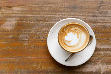 hot coffee on grunge wood background