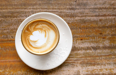 hot coffee on grunge wood background