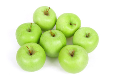 seven green apples isolated on a white background