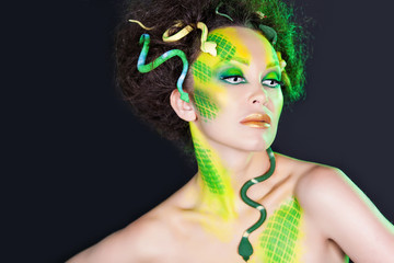 Naklejka premium fashion portrait woman with creative make up like a snake