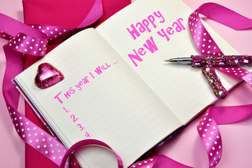 Pink Happy New Year resolutions in diary journal book