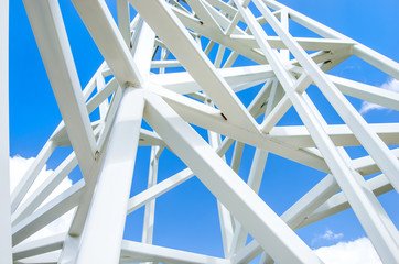 Close up on white steel tower on blue sky background