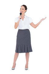 Fototapeta premium Cheerful presenter holding microphone