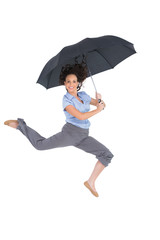 Happy classy businesswoman jumping while holding umbrella