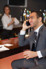 Smiling businessman having a phone call