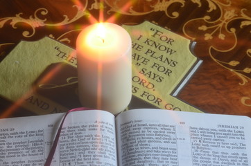 Holy bible cross by candlelight