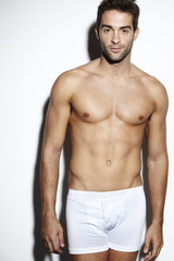 Fototapeta premium Attractive bare-chested male in underwear