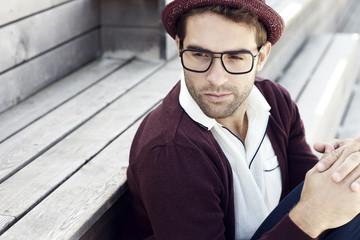 Handsome man sitting outdoors