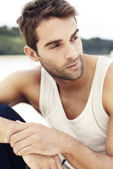 Handsome man sitting outdoors