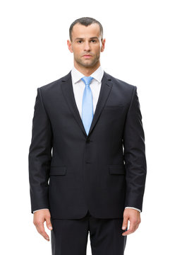 Half-length portrait of serious looking businessman