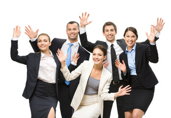 Group of happy executives with hands up, isolated 