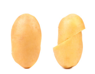Two fresh potatoes whole and cut.