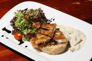 Close image of business lunch rise with fish and salad