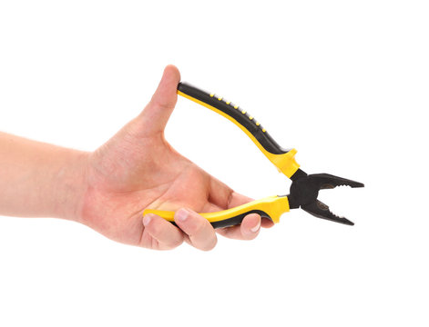 Hand holding pliers.