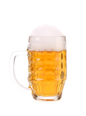 Full mug of beer with foam.
