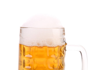 Closeup of full mug with beer foam.