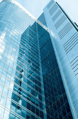Fototapeta na wymiar a part of modern business building against blue sky