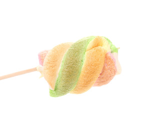 One colourful marshmallow on a stick.