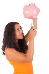 Young african american woman with piggy bank