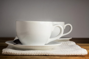 Two cups of espresso on white napkin