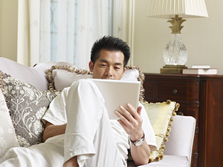 asian man working at home