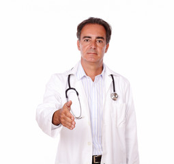 Fototapeta premium Charismatic doctor standing with greeting gesture