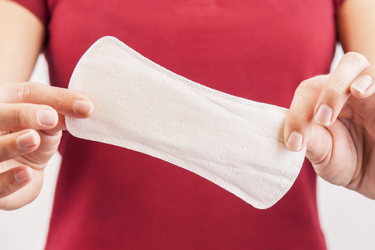 Young Woman Holding Menstrual Pad