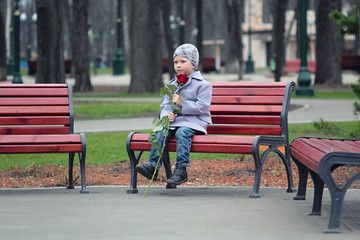 Little boy waiting in the park