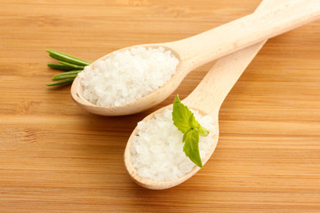 salt in spoons with fresh  rosemary and basil