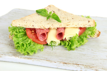 Tasty sandwiches with salami sausage and vegetables